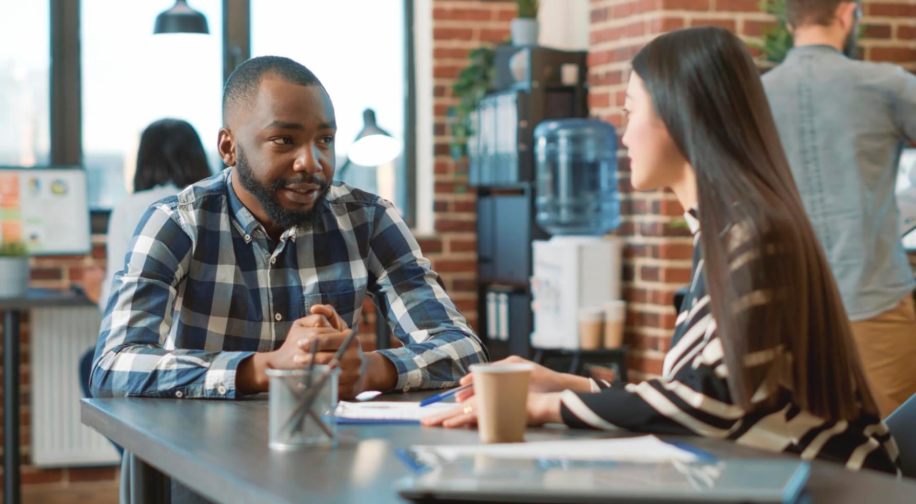 Budget planning workspace with financial documents and laptop