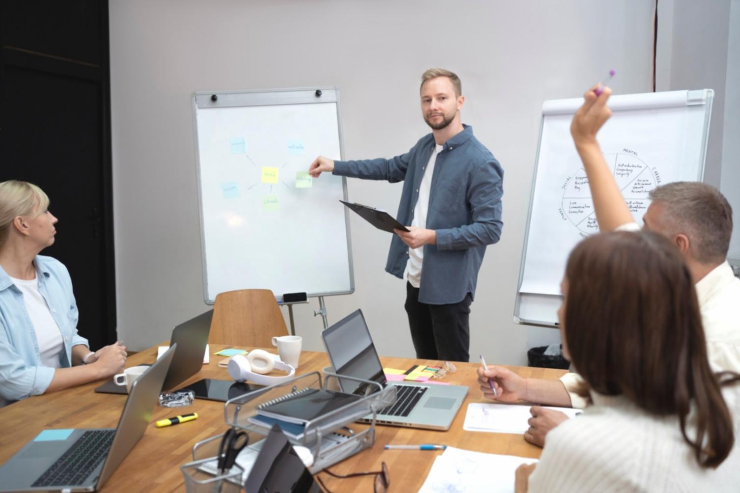Team working on budget software development in office environment